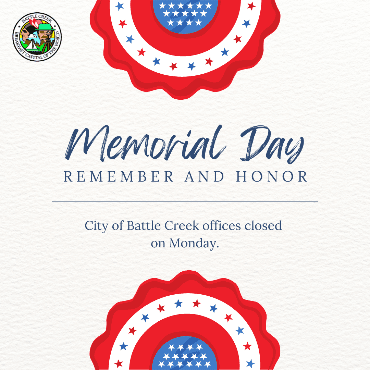 Round American flag banners with text saying city offices are closed Monday for Memorial Day