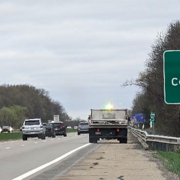 Vehicles driving on I-194 in Battle Creek near Columbia Avenue exit sign