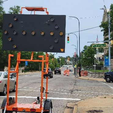 A photo showing the signage for the Division Street North lane shift, near City Hall.