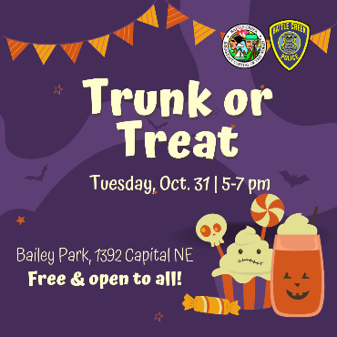 Purple graphic with orange banner flags and Halloween candies.