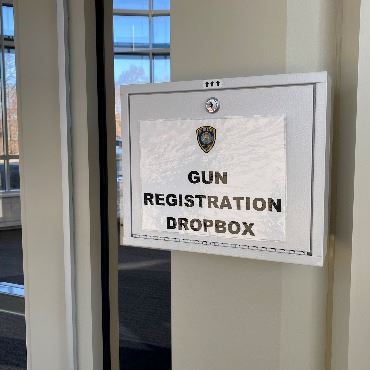 A photo of the drop box in the glass vestibule area of the Battle Creek Police Department lobby.