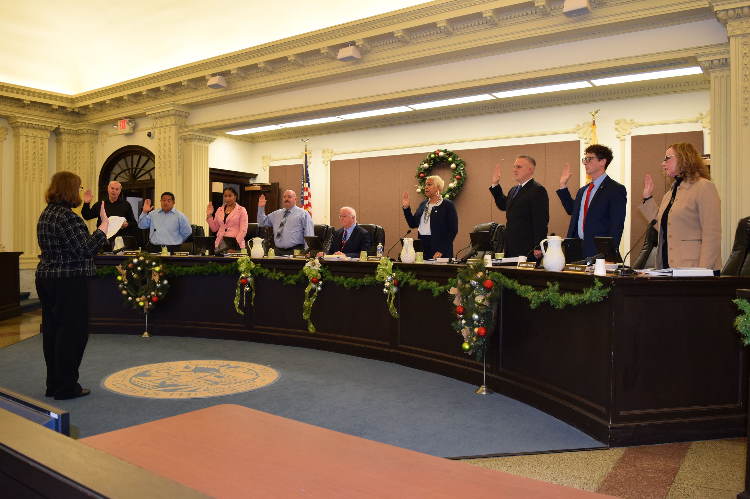City Clerk Victoria Houser administers the oath of office to all of the 2022-2024 City Commissioners