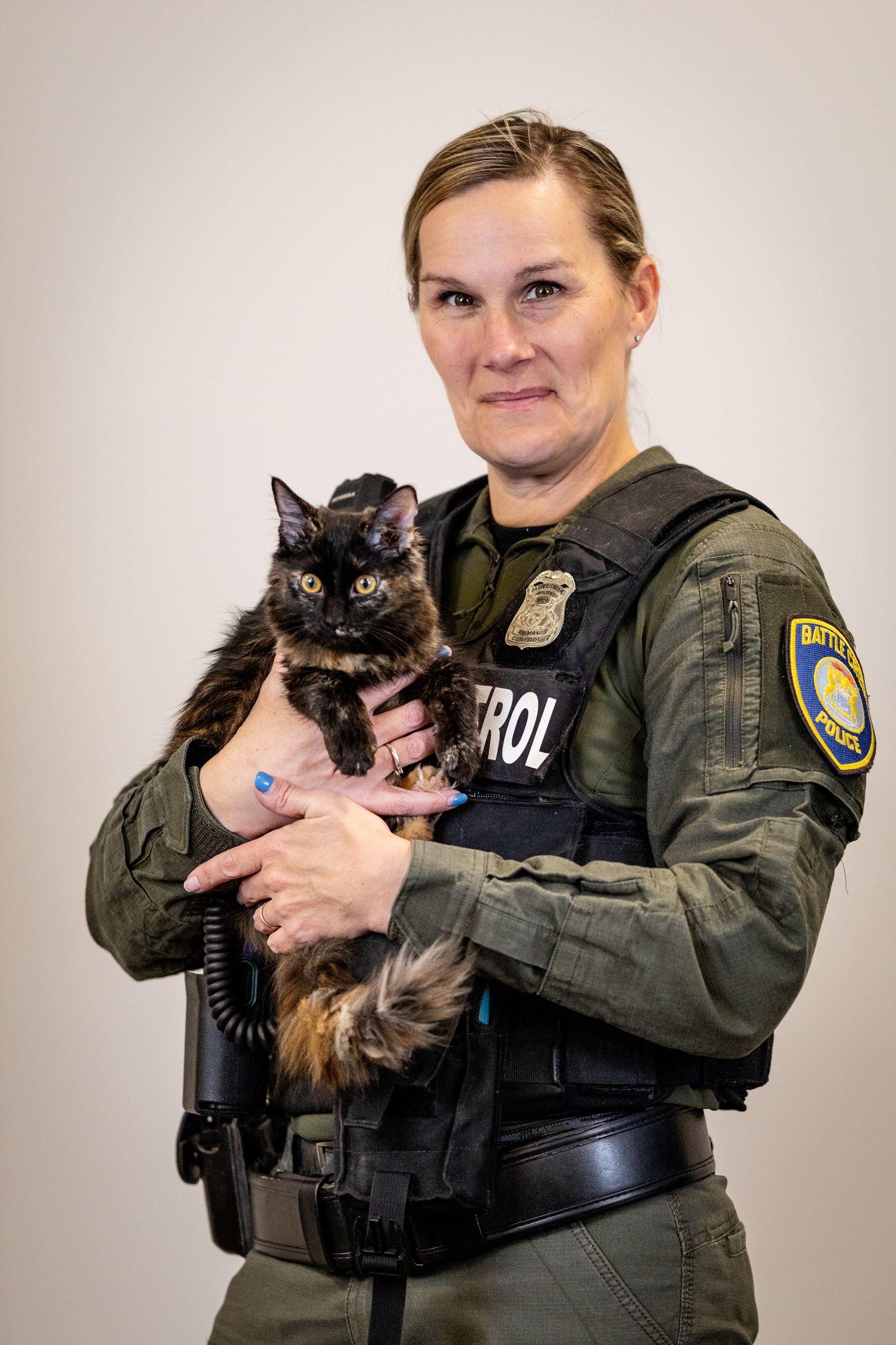 Animal Control Officer Brandi Caldwell, pictured with long-haired cat.