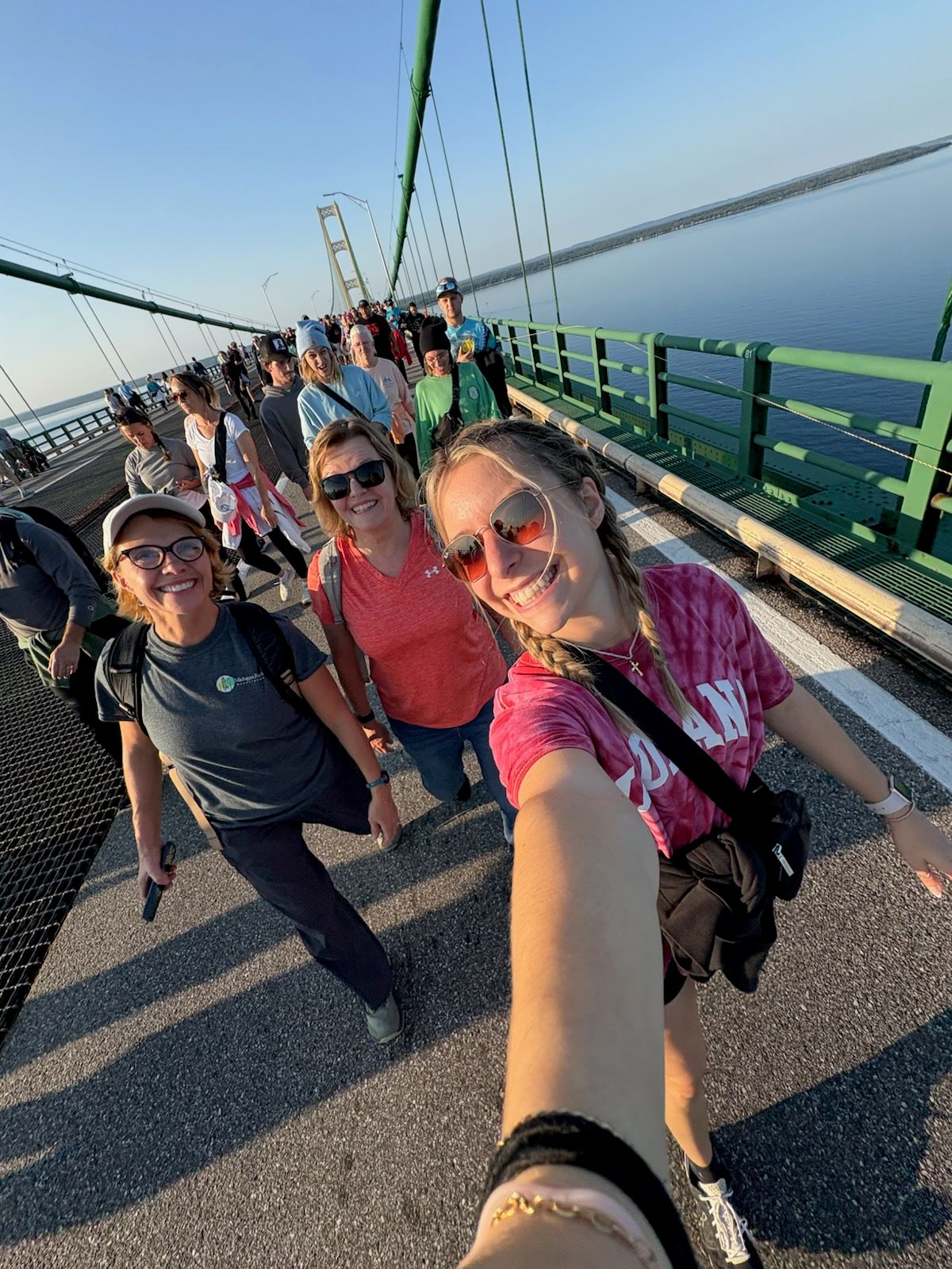 Hiker crossing a bridge on the trail